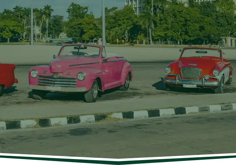 Vintage colorful cars parked in a row.
