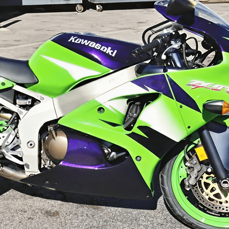 Dennis Buys Kawasaki sport motorcycle parked.